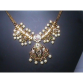 Pearl and gold necklace set with intricate detailing