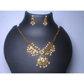 Pearl and gold necklace set with intricate detailing