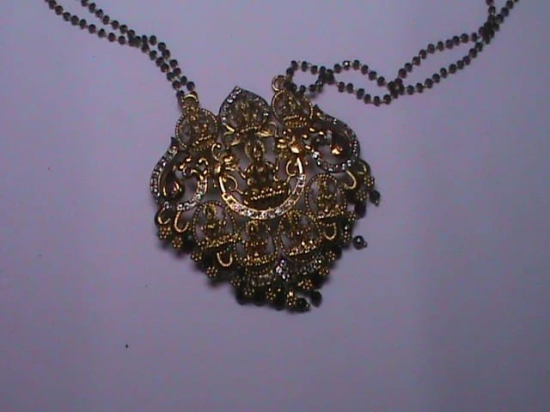 Delicate Gold Pendant on Black Beaded Chain