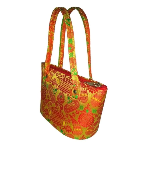 Red and yellow brocade handbag with green handles