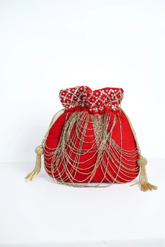 Embellished Red velvet with golden color embroidered potli bag