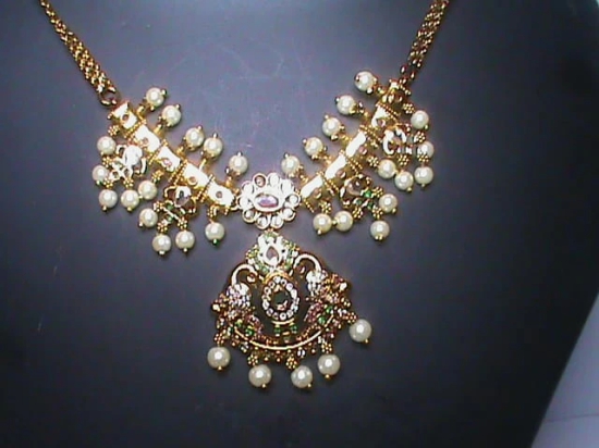 Pearl and gold necklace set with intricate detailing