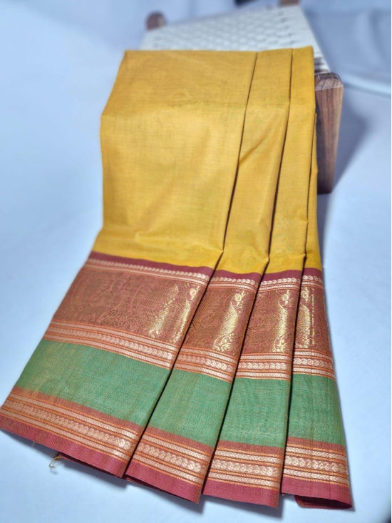 NVKCD001- Yellow color with Brown and Pastel Green Broder Kanchi Cotton  Handoven Saree
