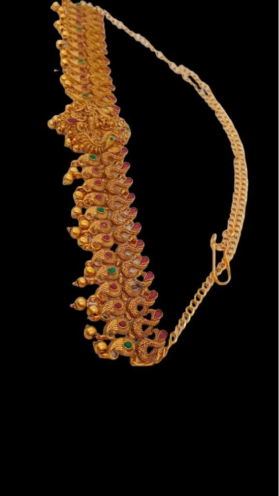 Stunning antique gold kamarband with intricate detailing and colorful stones.