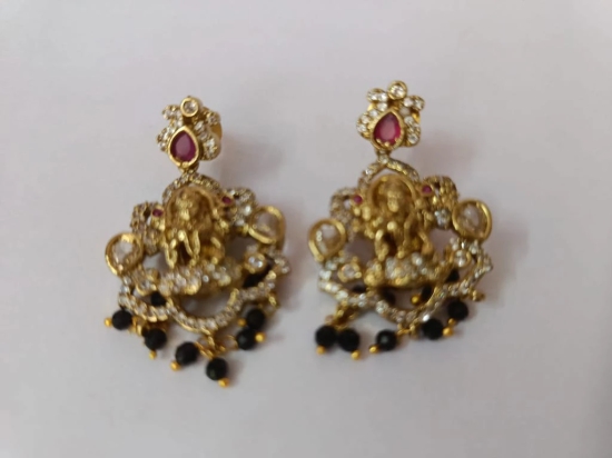 Stunning antique gold plated Goddess Lakshmi earrings with intricate detailing and black beads.