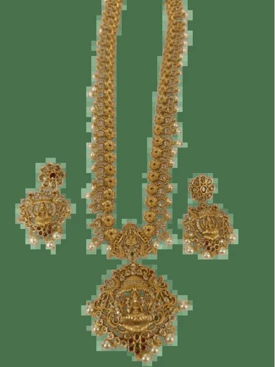 Stunning antique gold plated traditional Indian earrings with intricate detailing and pearl drops.