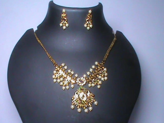 Pearl and gold necklace set with intricate detailing